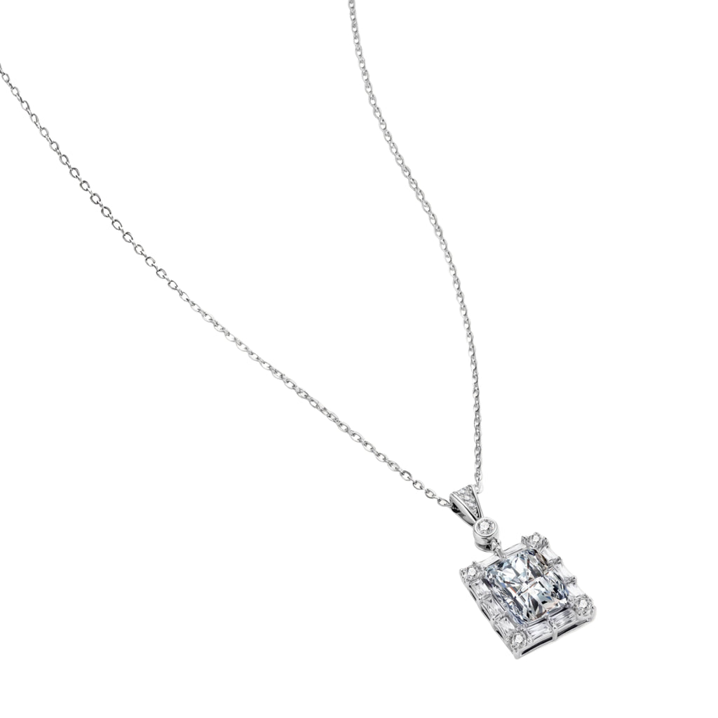 Square moissanite pendant with halo setting on delicate sterling silver chain against white background.