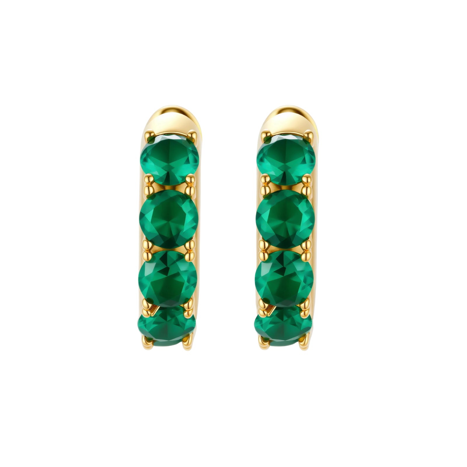 Close-up of gold-plated huggie hoop earrings featuring four emerald green cubic zirconia stones on white background.