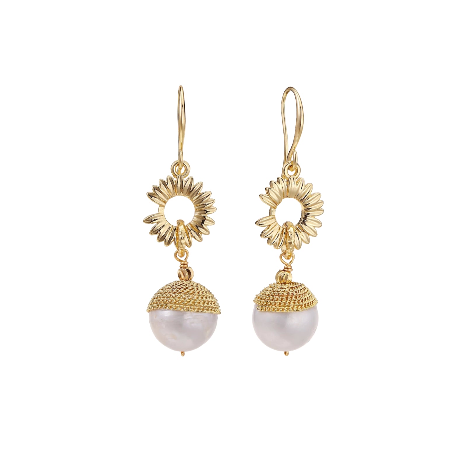 Gold sunburst charm earrings with baroque pearl drops on French hooks against cream background