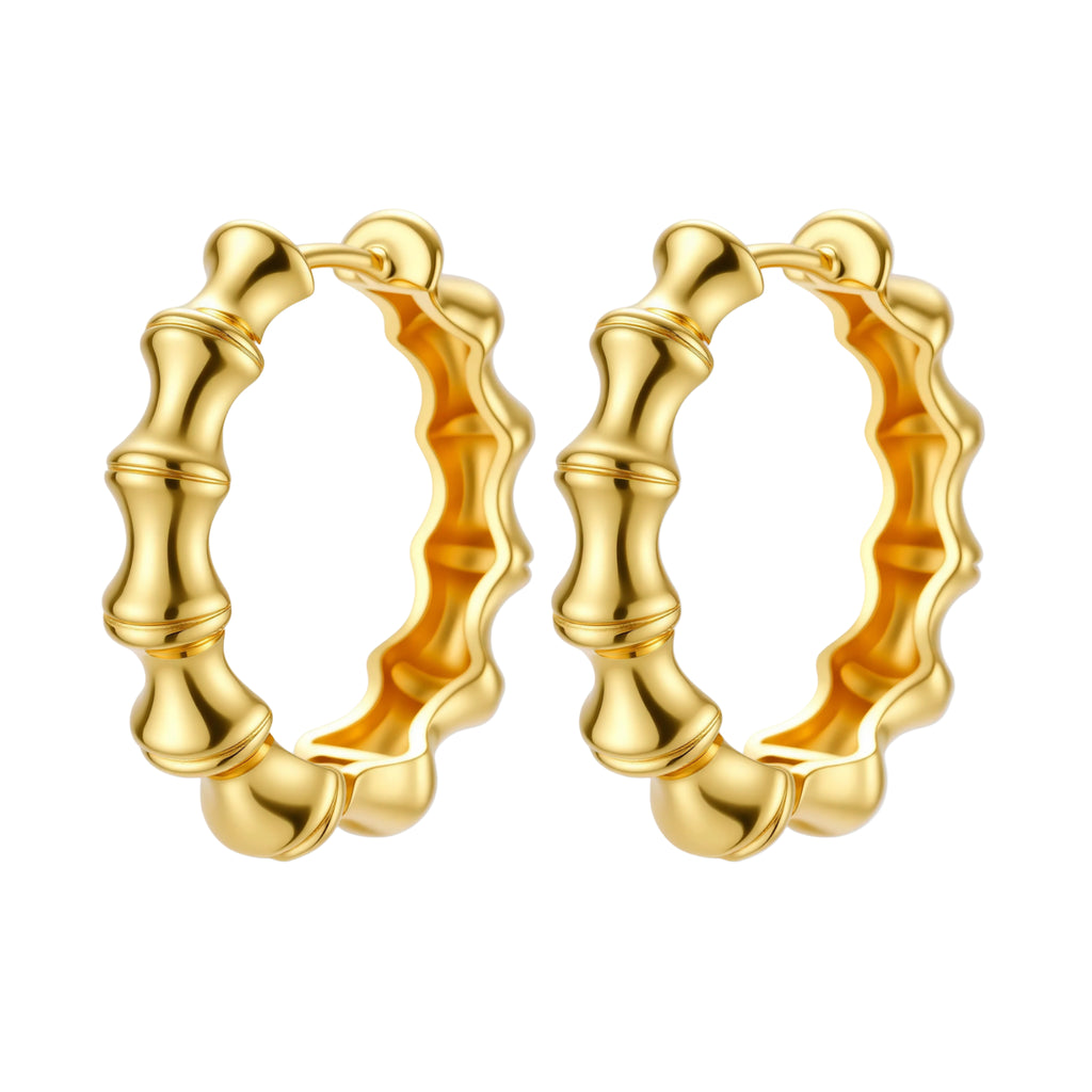 Close-up of gold-plated sterling silver hoop earrings with bamboo-inspired segmented design on white background.