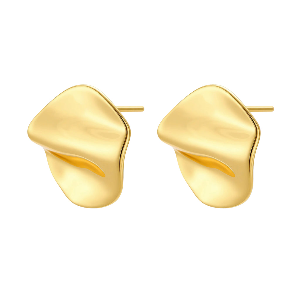 Close-up of organic gold-plated sterling silver stud earrings with flowing sculptural design and curved cut-outs