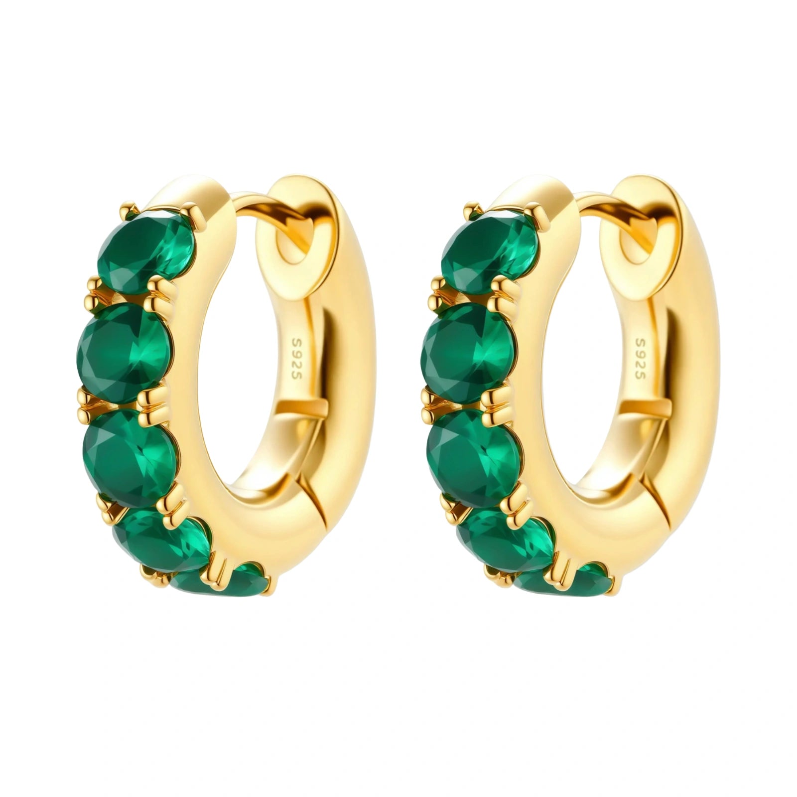 Close-up of gold-plated huggie hoop earrings featuring four emerald green cubic zirconia stones on white background.
