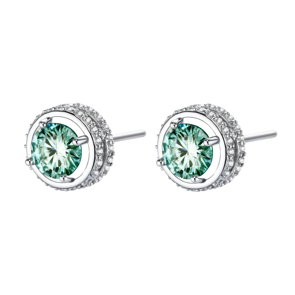 Round green moissanite stud earrings in sterling silver halo settings with brilliant sparkle on white background.