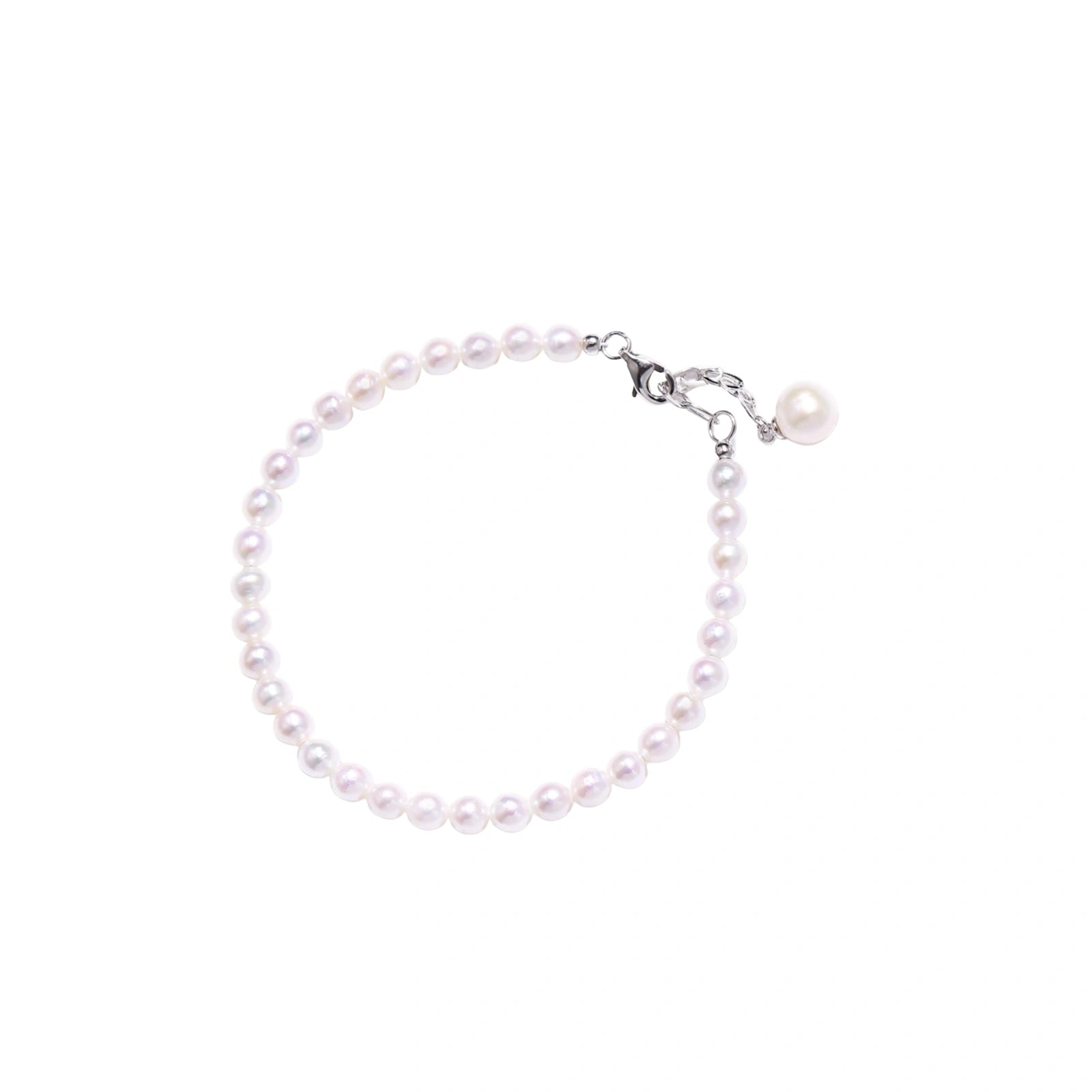 Adjustable bracelet featuring lustrous freshwater pearls with rhodium-plated sterling silver clasp on cream background.