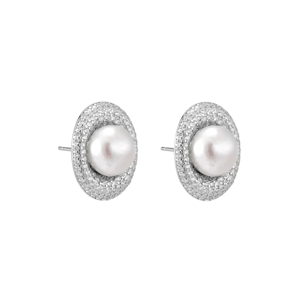 Elegant stud earrings with cream freshwater pearls surrounded by sparkly pavé crystals on rhodium-plated silver setting
