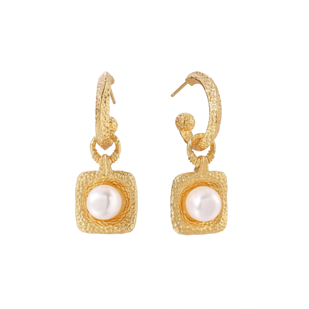 Pair of gold vermeil hoop earrings with textured square frames holding freshwater pearls on cream background