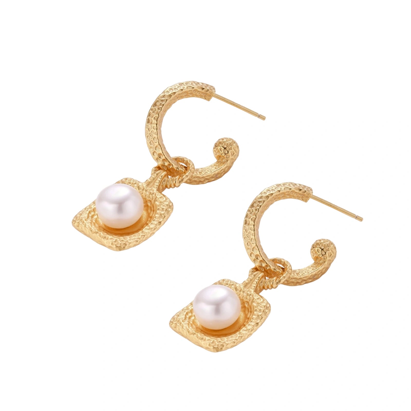 Pair of gold vermeil hoop earrings with textured square frames holding freshwater pearls on cream background
