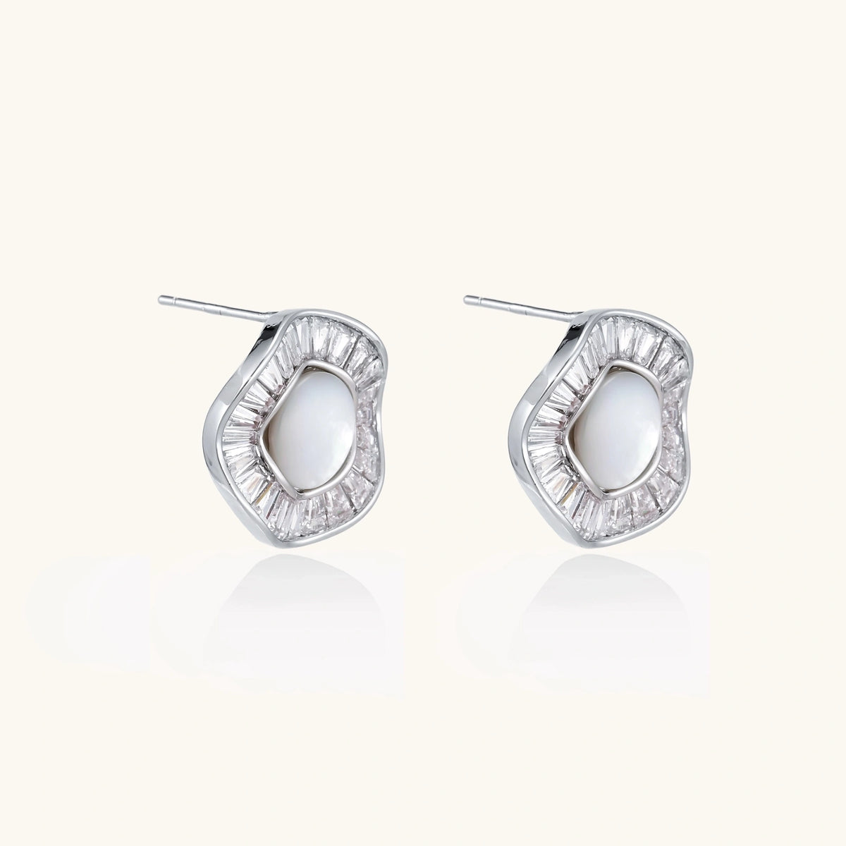 14K gold-plated stud earrings with freshwater pearl center surrounded by baguette-cut crystal halo in sunburst design