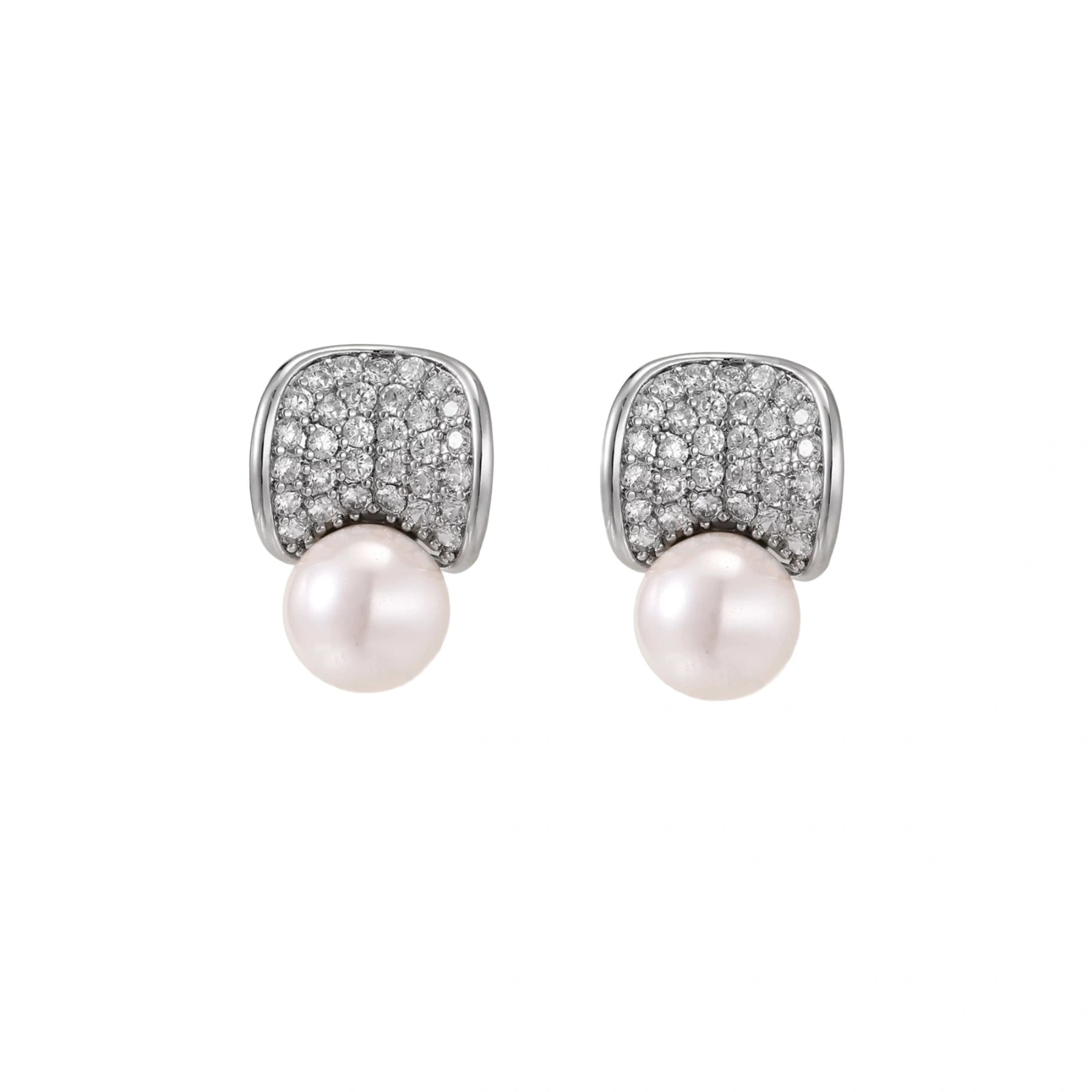 Curved pavé diamond studs in white gold-plated brass cradle lustrous freshwater pearls against cream background