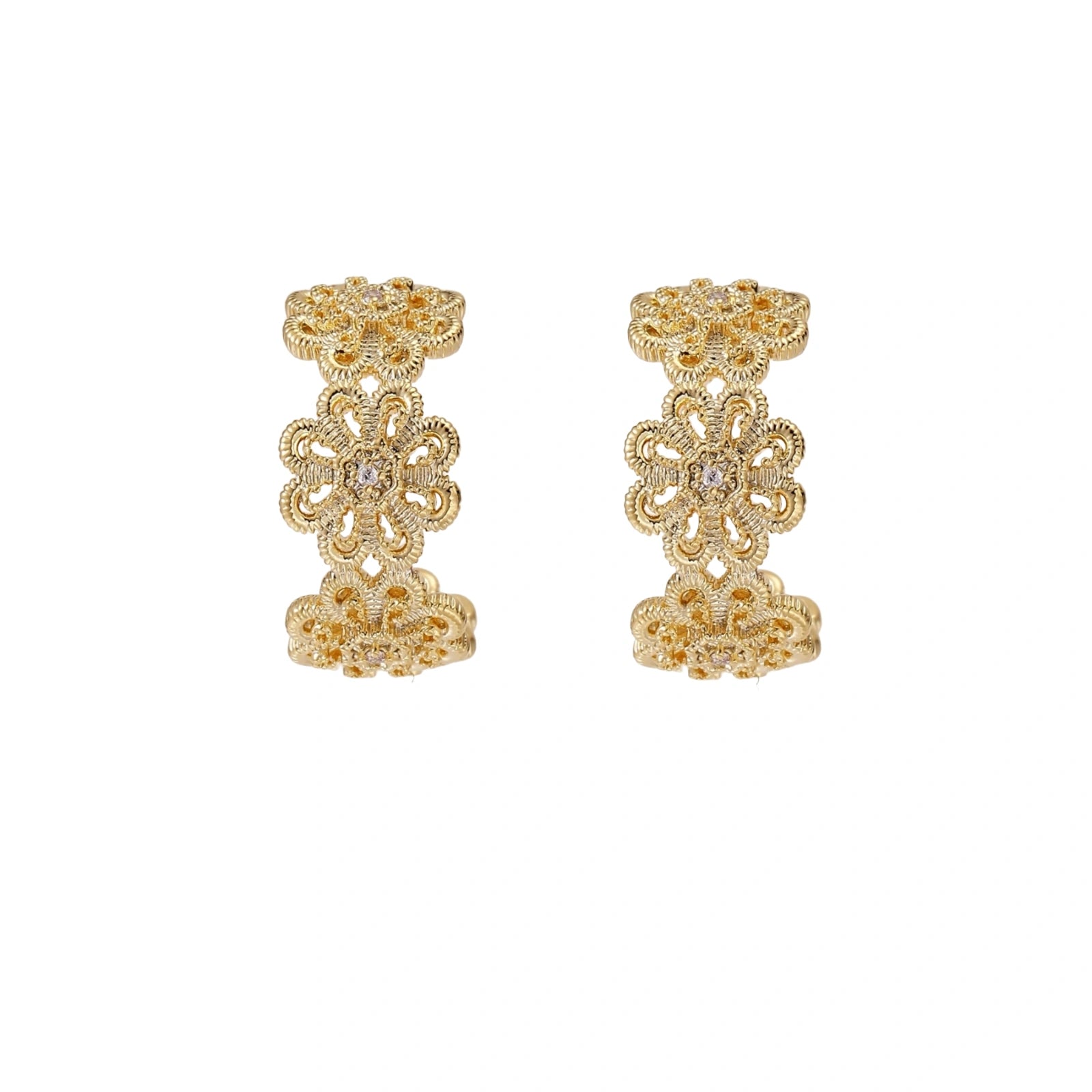Gold hoop earrings with intricate three-dimensional floral filigree pattern in 14K gold plated brass on cream background