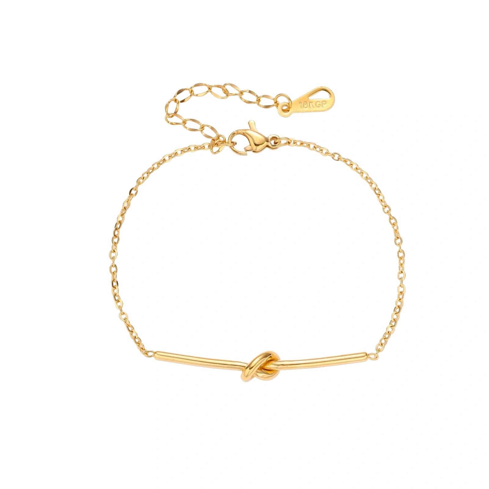 Delicate gold chain bracelet with minimalist bar and centered knot detail on cream background