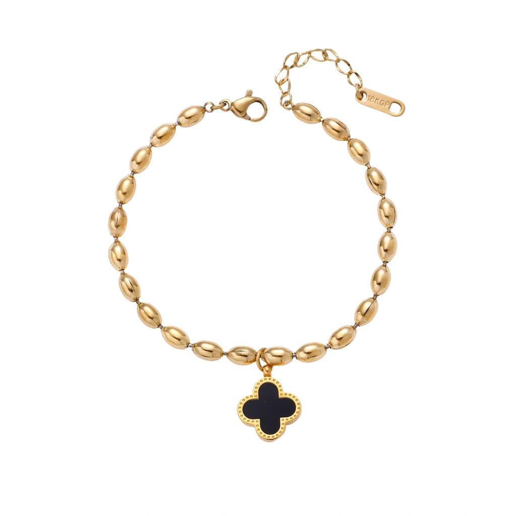 18K gold-plated oval bead chain bracelet with quatrefoil clover charm featuring mother of pearl inlay on cream background