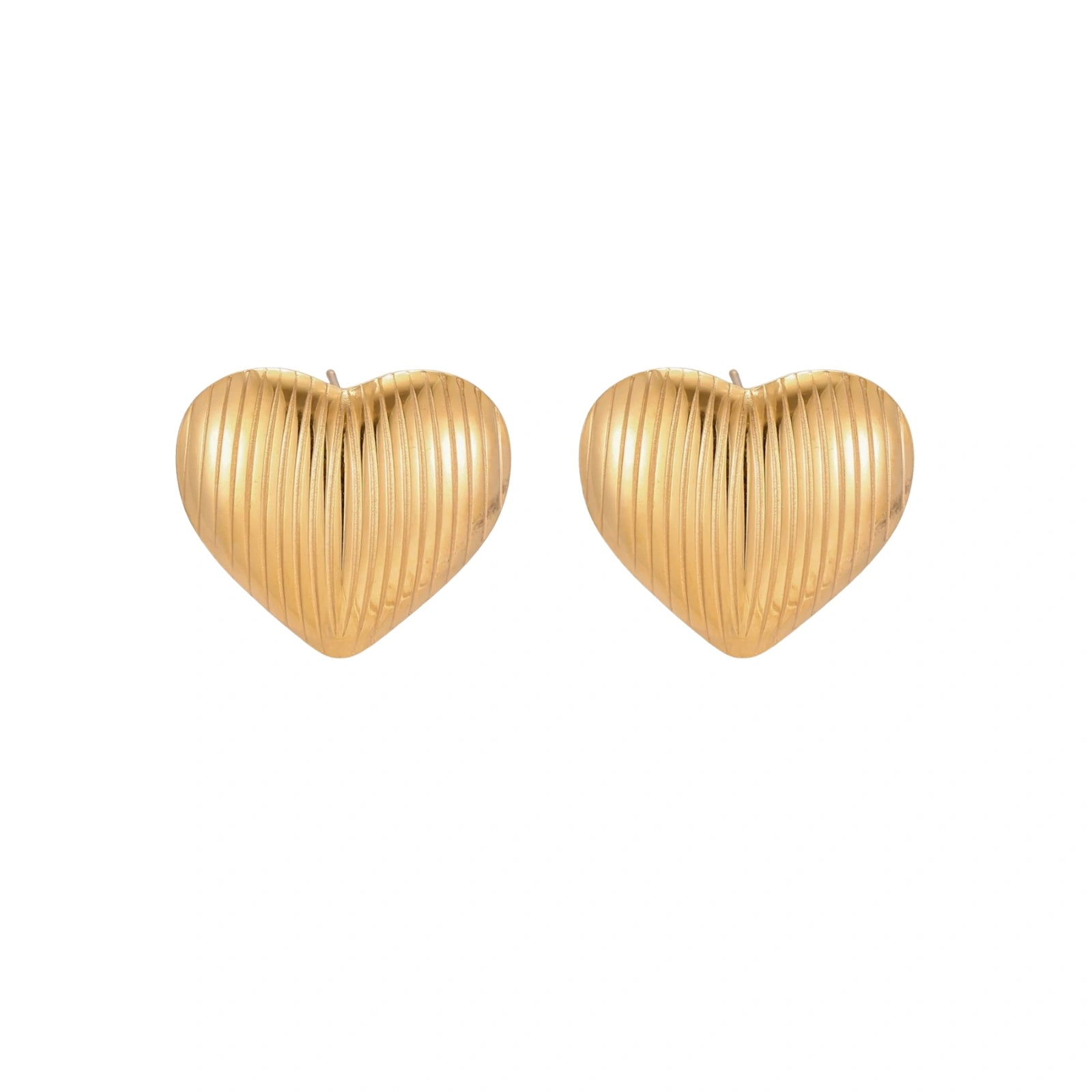 Gold heart-shaped stud earrings with parallel ridged texture on cream background