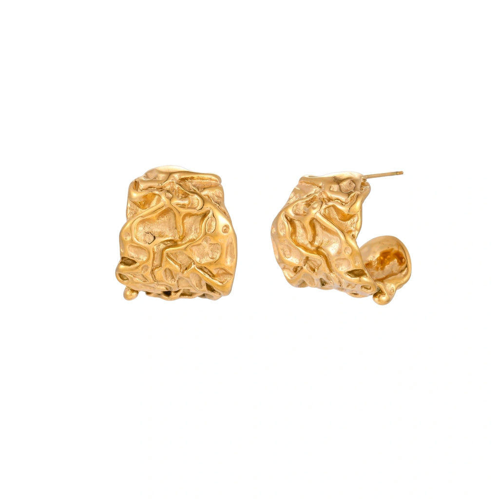 Chunky gold-plated hoop earrings with organic crumpled texture on cream background, 21.5mm sculptural design