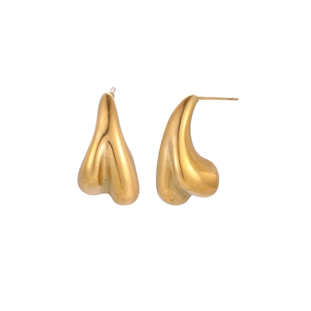 Organic sculptural gold stud earrings with fluid matte finish on cream background