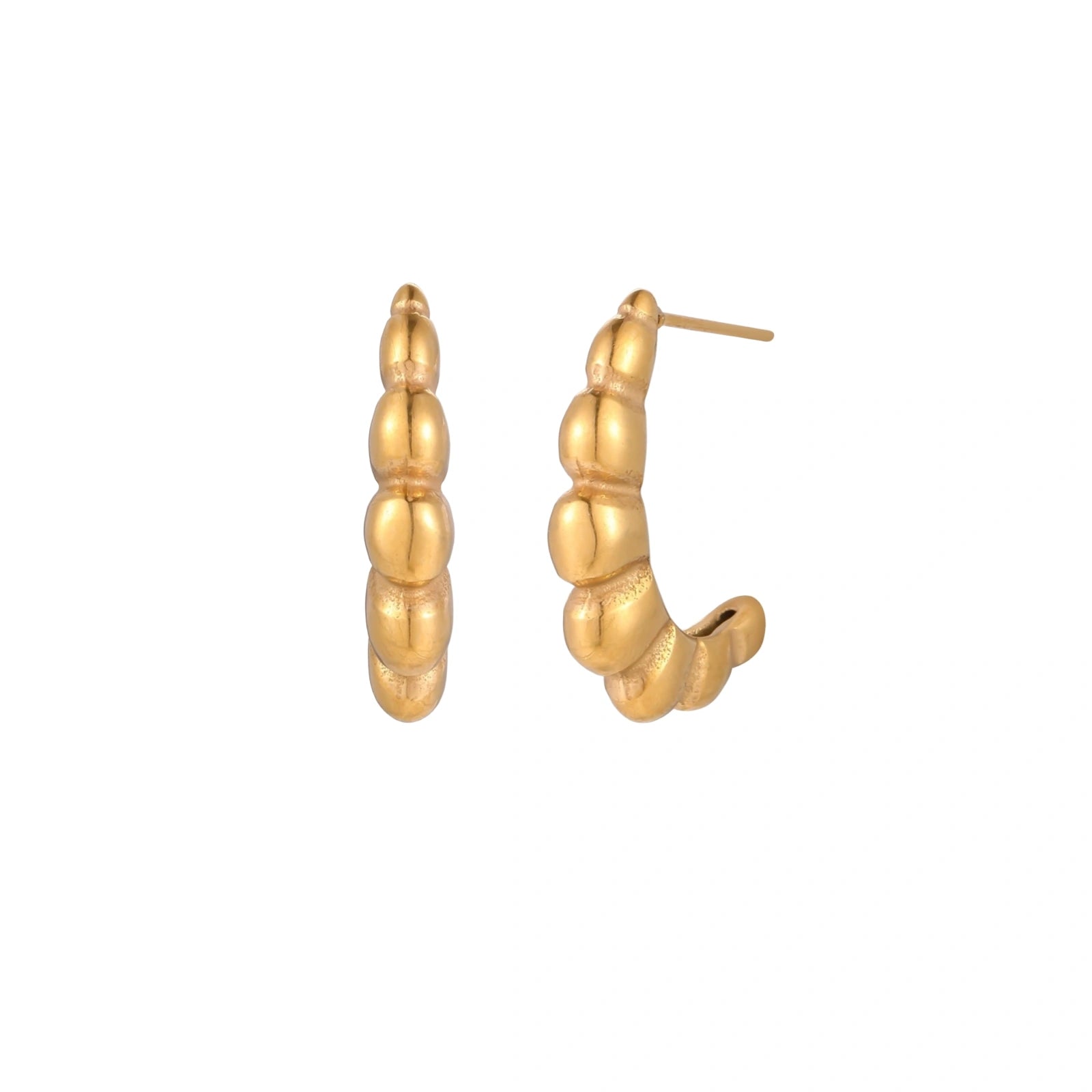 Gold-plated chunky hoop earrings with ridged bubble texture on cream background