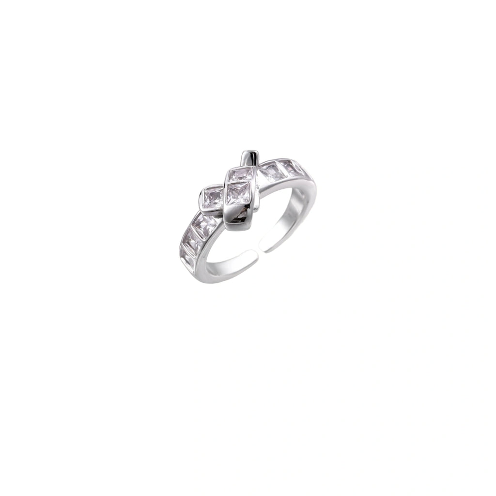 White gold plated adjustable ring featuring offset square cubic zirconia stones in an architectural stacked design