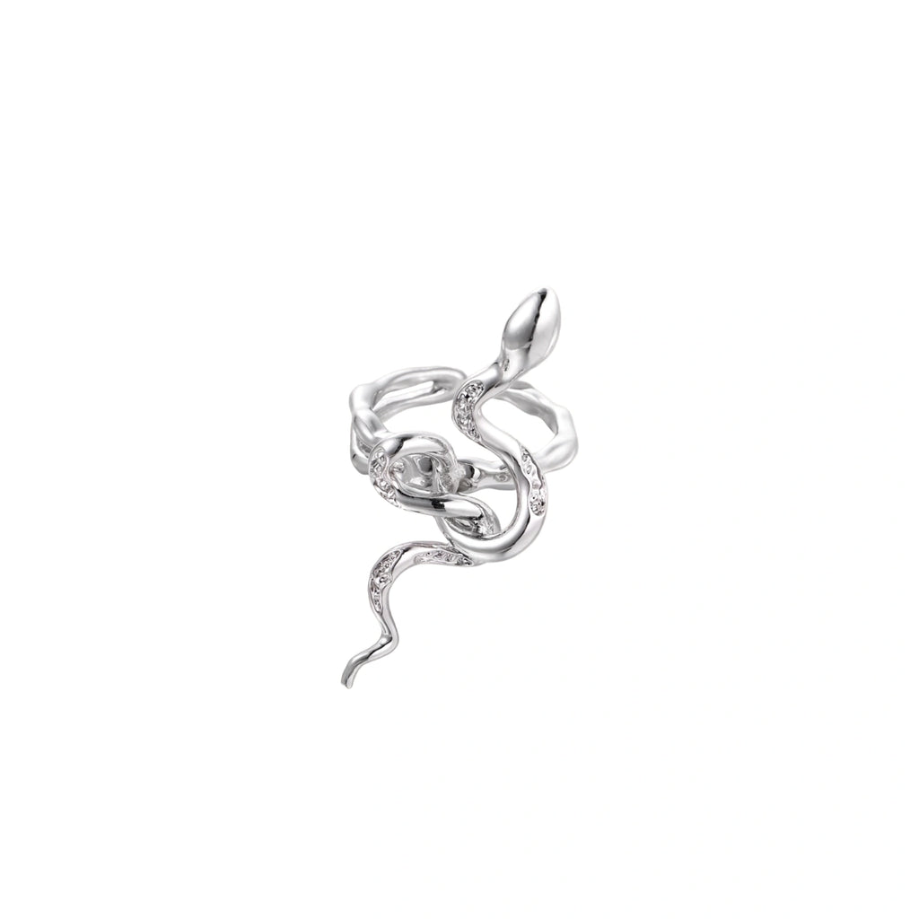 Sculptural white gold-plated snake ring with crystal accents coiling around finger in bold open design