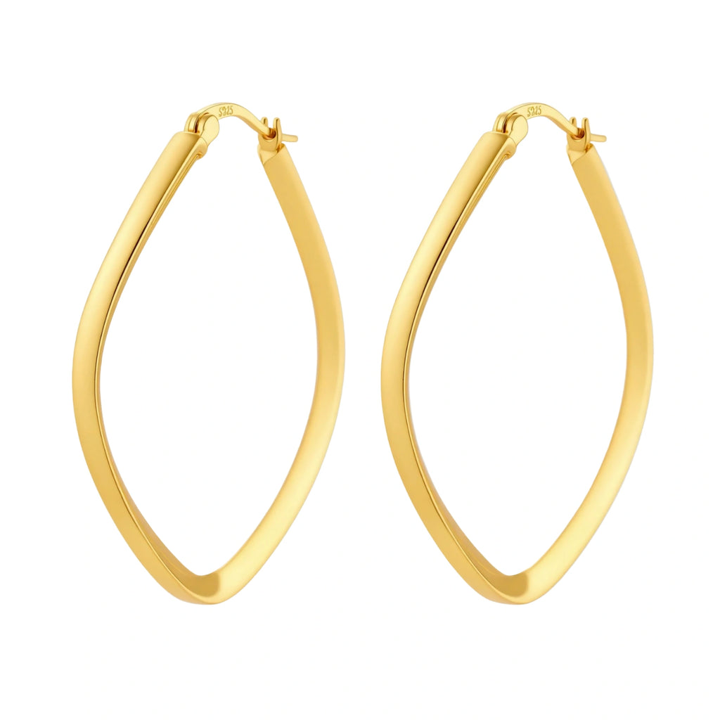 Set of geometric gold-plated sterling silver hoop earrings in oval and cushion shapes on cream background