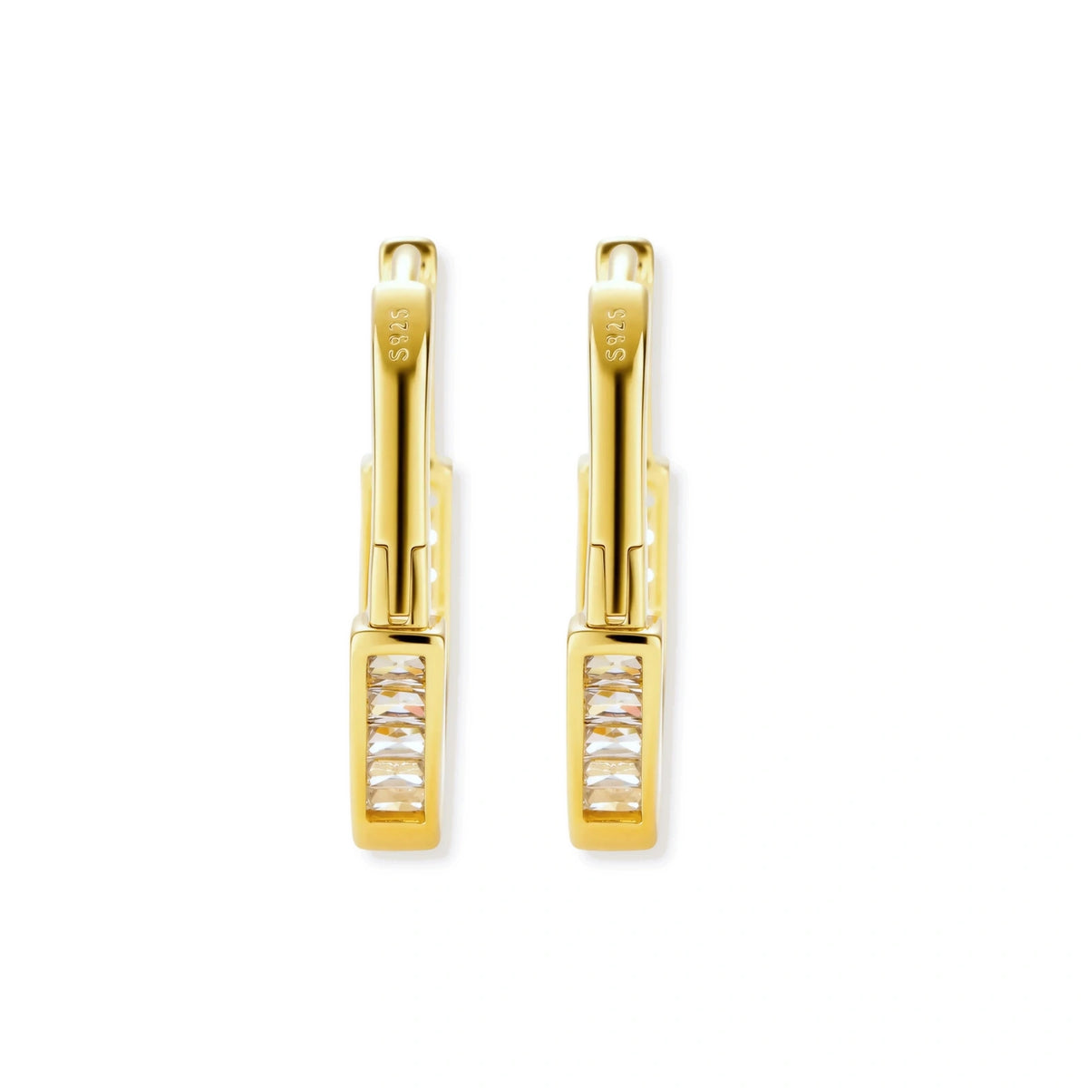 Close-up of gold-plated sterling silver huggie hoop earrings featuring rectangular cubic zirconia stones on neutral background.
