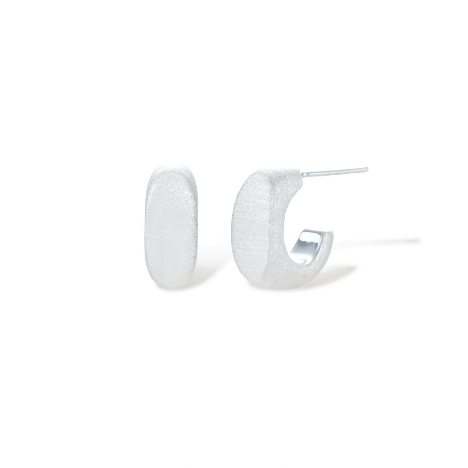 Pair of small silver-plated huggie hoop earrings with clean minimal design on neutral background.