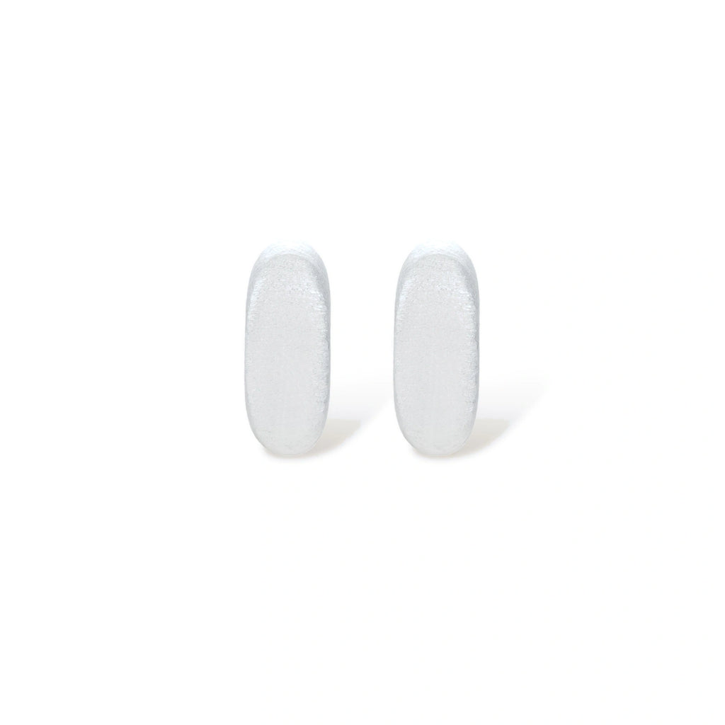 Pair of small silver-plated huggie hoop earrings with clean minimal design on neutral background.