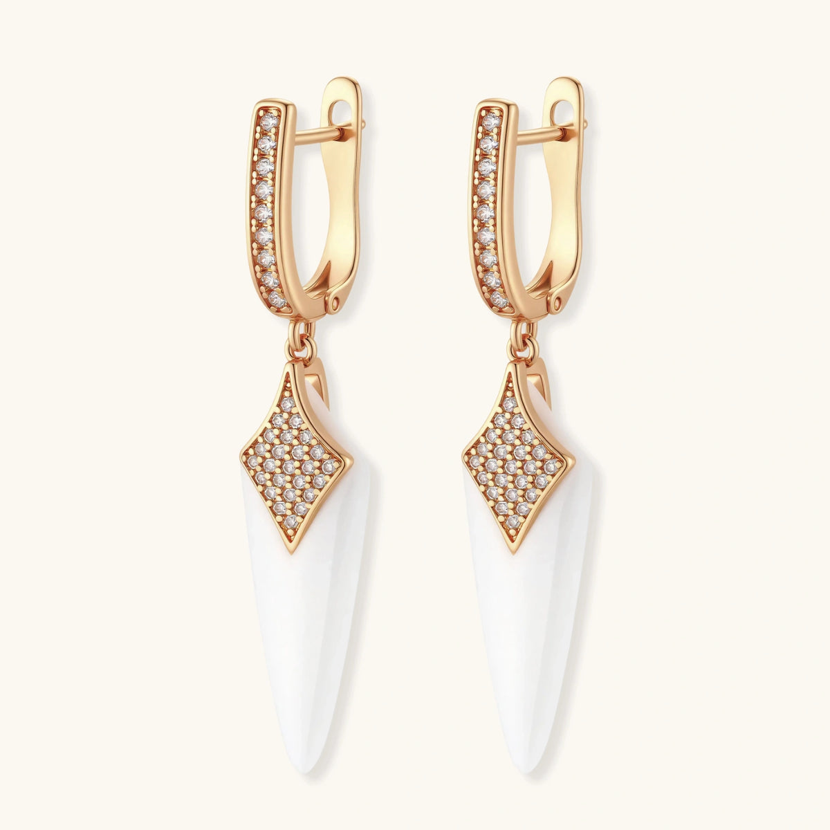 Rose gold huggie drop earrings with pave zircon diamond-shaped tops and white ceramic spike pendants.